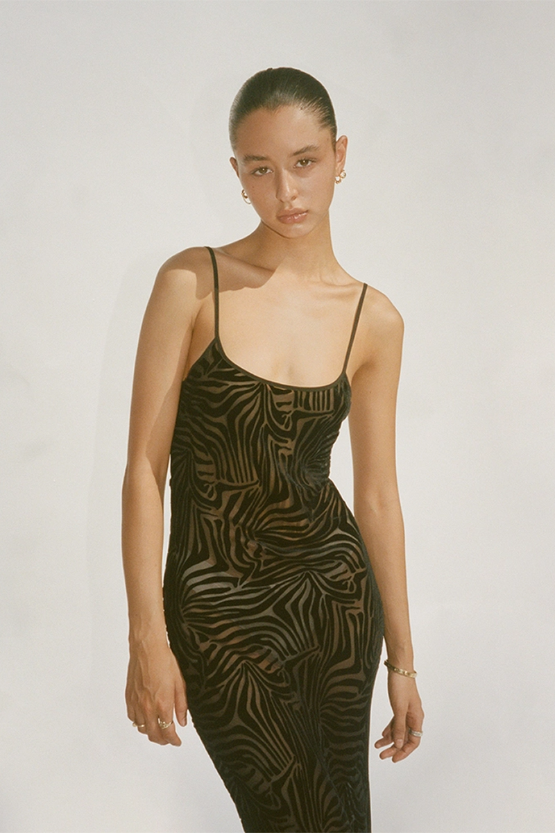 realisation par brown zebra dress The Gia in Animal is back in stock on all sites Bell sleeves and floor length, she's the ultimate holiday dress